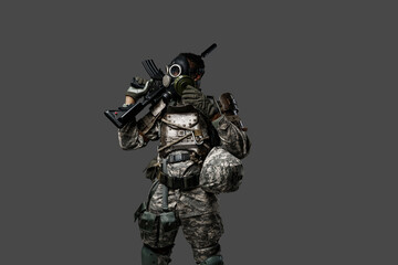 Studio shot of black army soldier dressed in protective gas mask and camouflage clothes.