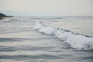 on the black sea small waves in the afternoon in summer