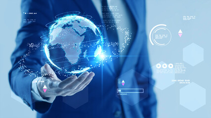 Metaverse virtual reality technology, businessman virtual globe and business finance data working online communicating with computer in virtual office mixed reality digital technology