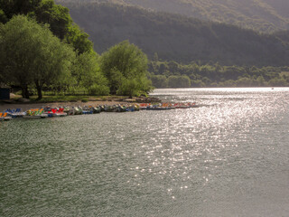 
Image of Lake Scanno with pedal boats in the background. Travel to Abruzzo Italy