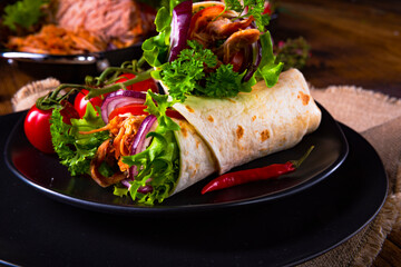 tasty pulled pork wrap with vegetables.