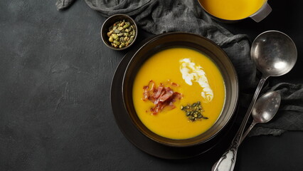 Creamy pumpkin soup with bacon. Healthy organic pumpkin cream soup
