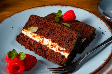 Rustic chocolate cake with raspberries and coffee
