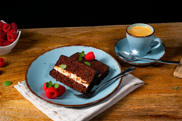Rustic chocolate cake with raspberries and coffee