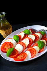 Tomato with mozzarella and basil