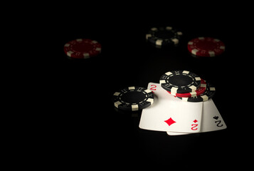 Playing cards on a black table with a winning combination one pair in game poker and chips in the background