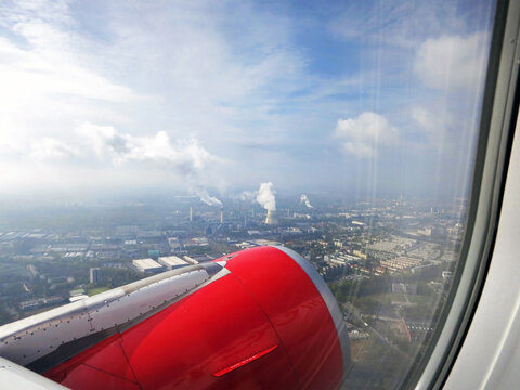 View from airplane window over industrial area