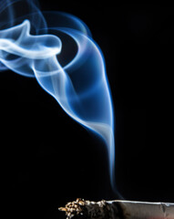 Cigarette smoking closeup isolated on balck background. No smoking concept