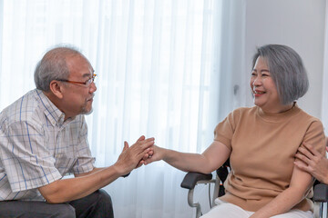 Fototapeta premium A happy retired couple looking each other at home.