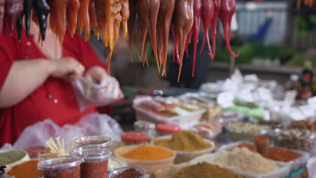 woman selling spices and Churchkhela in the local market, Kutaisi, Georgia. High quality 4k footage