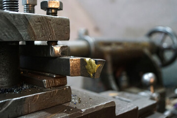 Closeup of a metal cutter of old Lathe Machinery. Vintage Industrial Machinery in a old factory. Selective focus.