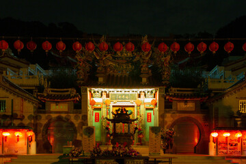Fototapeta na wymiar temple in night with flowers and lantern