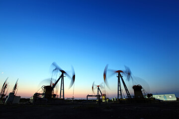in the evening, oil pumps are running