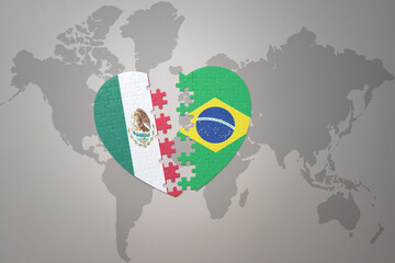 puzzle heart with the national flag of brazil and mexico on a world map background.Concept.