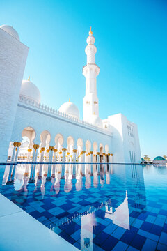 Sheikh Zayed Grand Mosque Minaret View With The Pool And Blue Sky