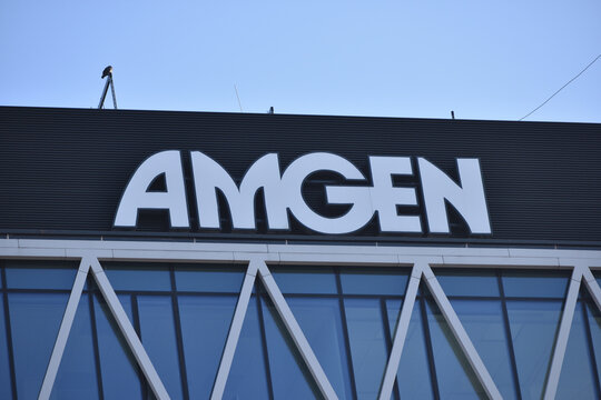 Amgen signage, logo on the facade American multinational biopharmaceutical company. WARSAW, POLAND - JANUARY 9, 2022