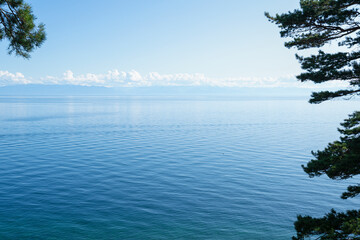 Landscape with the coast of Lake Baikal in calm clear weather .