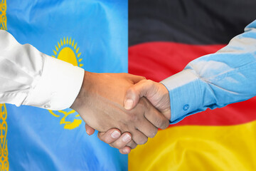 Handshake on Kazakhstan and Germany flag background. Support concept