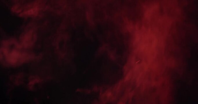 Red Smoke on black background rising closeup footage