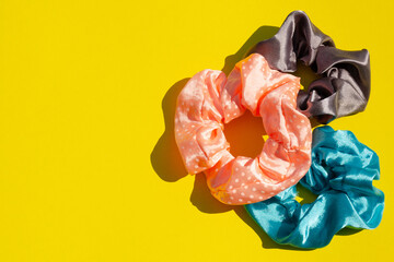 Wavy hair bands yellow background background flat lay close-up