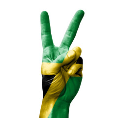 Hand making the V victory sign with flag of jamaica