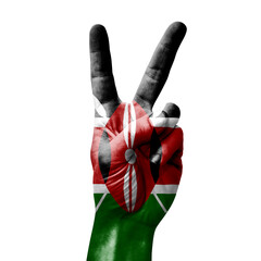 Hand making the V victory sign with flag of kenya