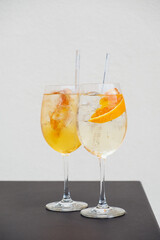 Two glasses of Spritz cocktail served on the terrace of urban bar. Popular Italian wine based beverage and summer aperitif refreshing drink.
