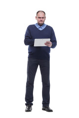 in full growth. serious man with a digital tablet.