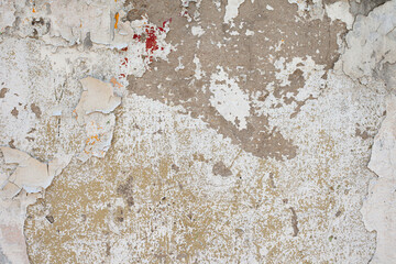 Peeling paint on a wall. Old concrete wall.