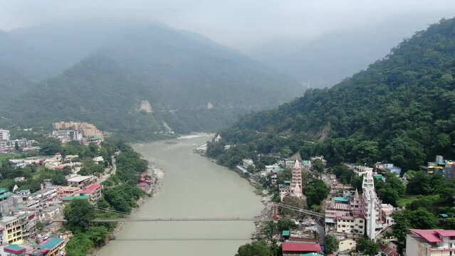 An aerial shot of Laxman Jhula over the river ganga in Rishikesh,Uttarakhand,India
