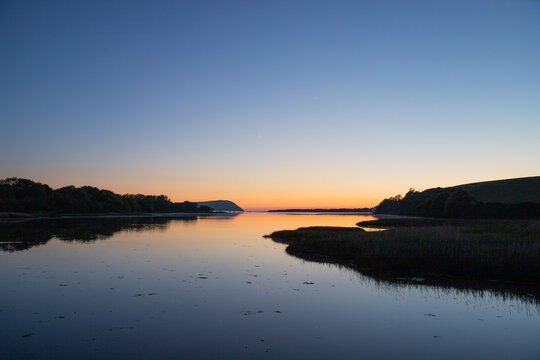 Sunset Over Newport Estuary In Pembrokeshire, Wales