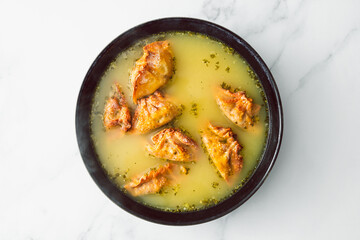 healthy plant-based food, homemade Chinese wonton dumplings soup with lentil carrot and onion filling