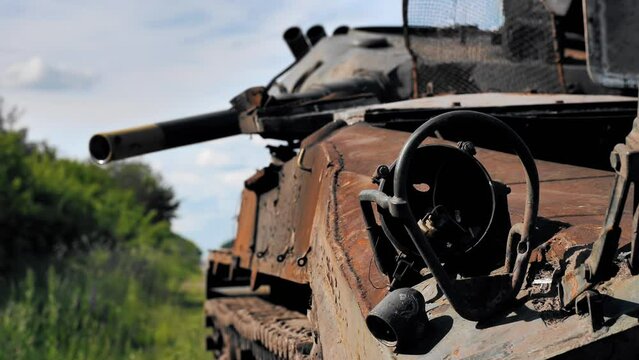 Burnt and destroyed Russian military equipment on a roadside in Ukraine. Attack of the Russian invaders. Infantry fighting vehicle (IFV). Destroyed military equipment. Russian aggression in Ukraine.