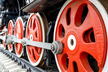 red metal wheels of an old train. retro train at the exhibition