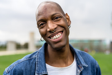Happy African gay man celebrating pride festival - LGBTQ community concept