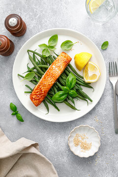 Grilled salmon fish fillet and green beans with lemon and basil