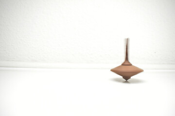 Spinning top in motion and holding balance