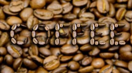 The word Coffee is made from coffee beans on a coffee background