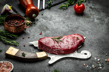 raw sirloin beef rump steak on black background, meat semi finished product. top view