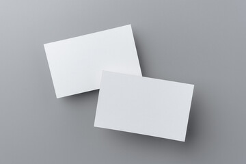 two business card isolated on grey background