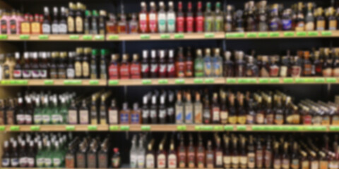 Alcohol showcase blurred background. Blurred abstract background of shelf in supermarket