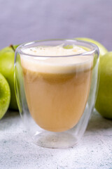 Apple juice. Freshly squeezed juice. Freshly squeezed apple juice in glass on stone background. Close-up