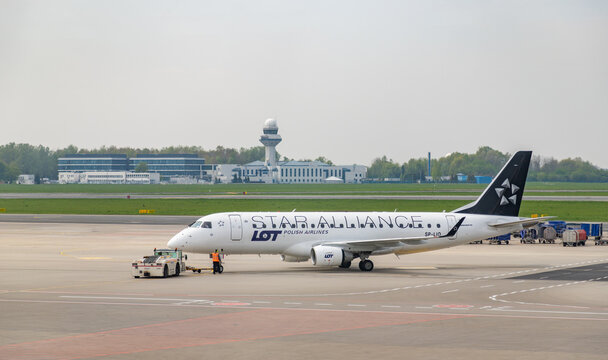 Warsaw, Poland - May 6, 2022: A picture of a Star Alliance - LOT Polish Airlines plane taxiing on the Chopin Airport, in Warsaw.