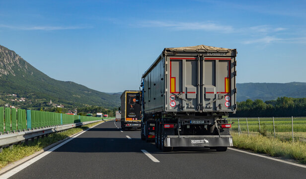 Ljubljana, Slovenia - May 11, 2022: A picture of some trucks driving on the highway near Nova Gorica, Slovenia.