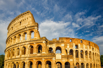 Fototapeta na wymiar The Colosseum amphitheatre in the centre of the city of Rome at sunset, Italy, Europe.