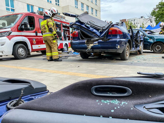 Firefighter team at the site of car crash accident.
