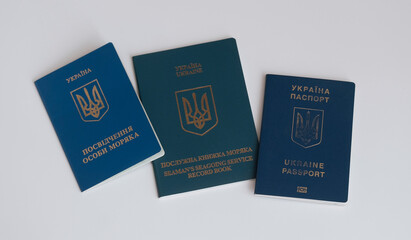 Ukraine, Europe - 06 01 2022: Set of seaman's passport and Ukrainian international biometric passport