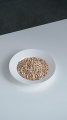 Bowl with healthy food on the table. Bowl with oatmeal porridge.