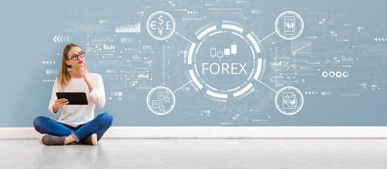 Forex trading concept with young woman holding a tablet computer