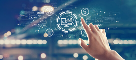Marketing Strategy concept with hand pressing a button on a technology screen